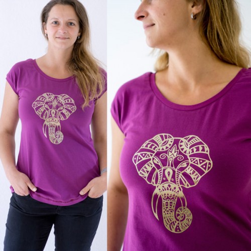 Frau im lila T-Shirt mit goldenen Mandala Elefanten als Bügelbild